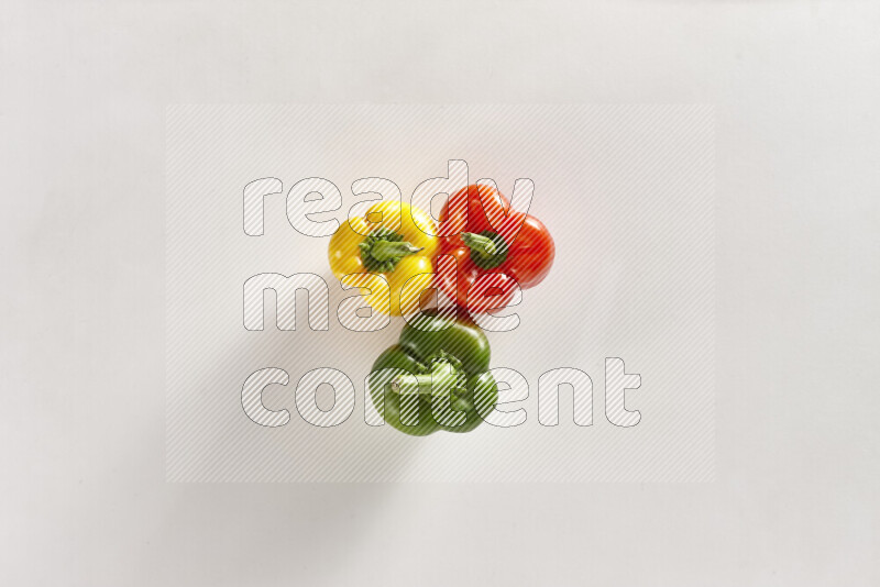 Assorted bell peppers on white background