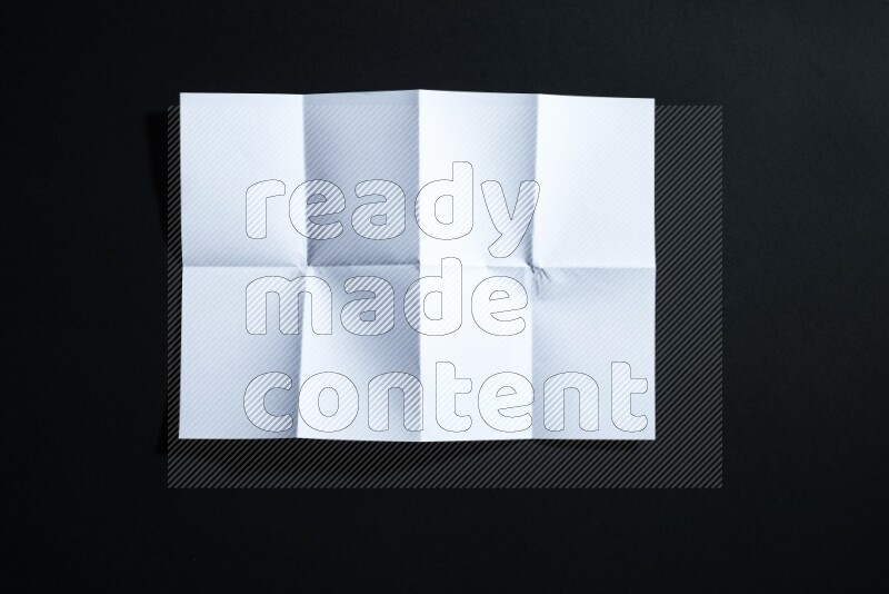 White paper sheet on black background