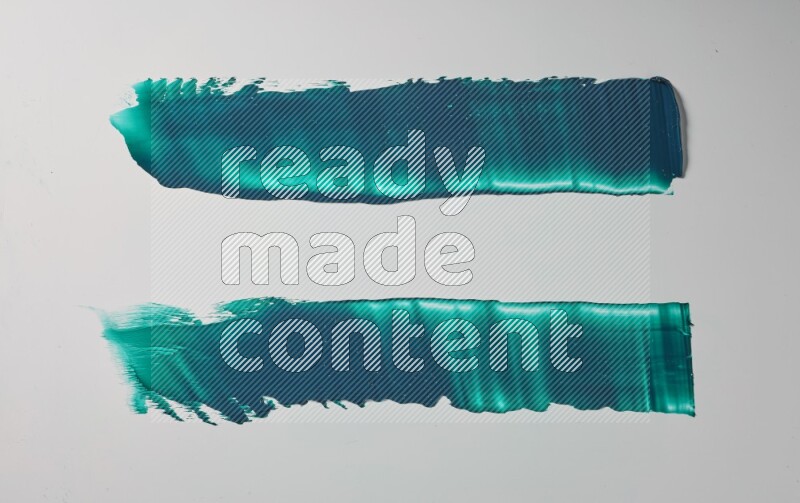Turquoise painting knife strokes on white background