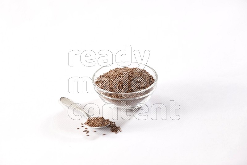A glass bowl full of flax and a metal spoon full of the seed on a white flooring in different angles
