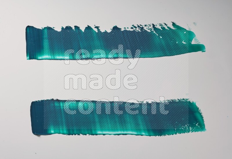 Turquoise painting knife strokes on white background