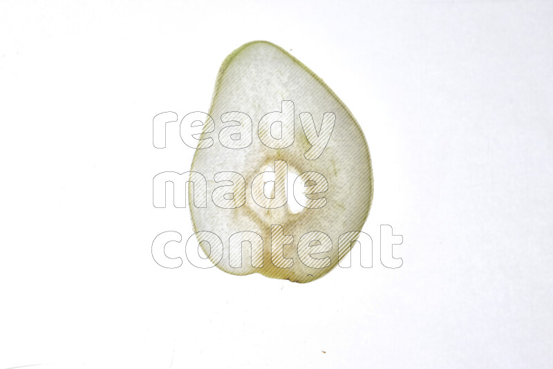 Pear slices on illuminated white background