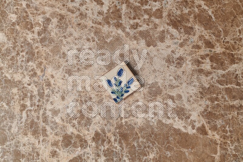 A decorative coaster on beige marble background