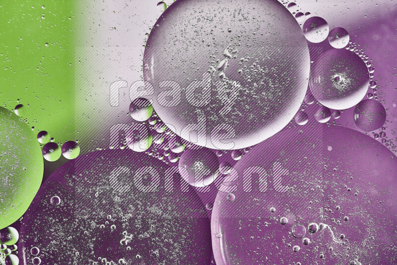 Close-ups of abstract oil bubbles on water surface in shades of purple, green and white