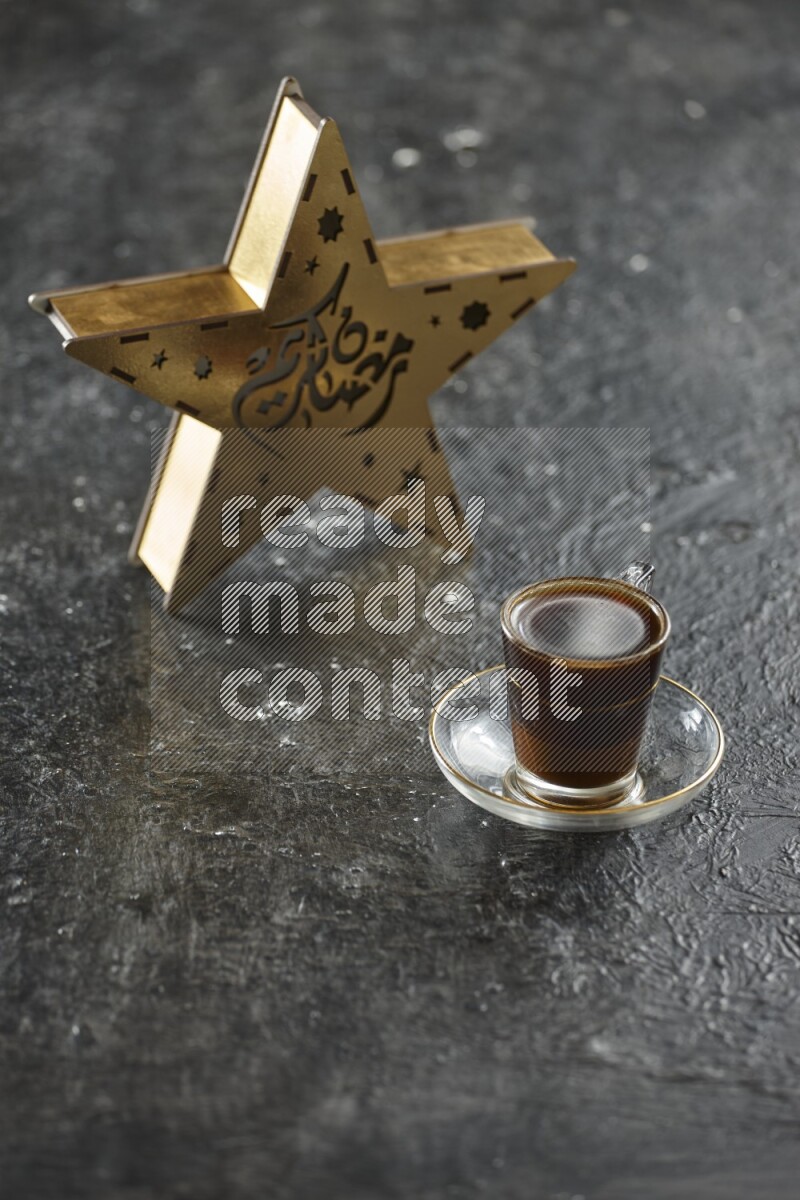 A wooden golden star lantern with different drinks, dates, nuts, prayer beads and quran on textured black background