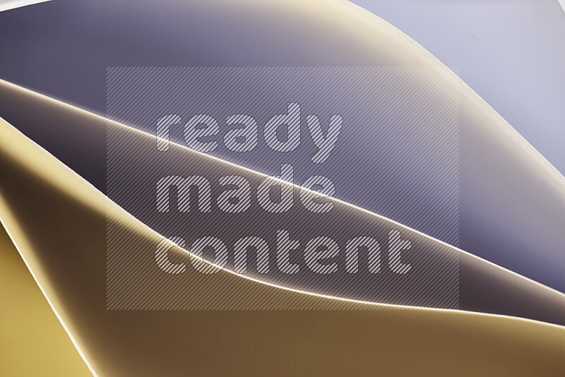 This image showcases an abstract paper art composition with paper curves in gold gradients created by colored light