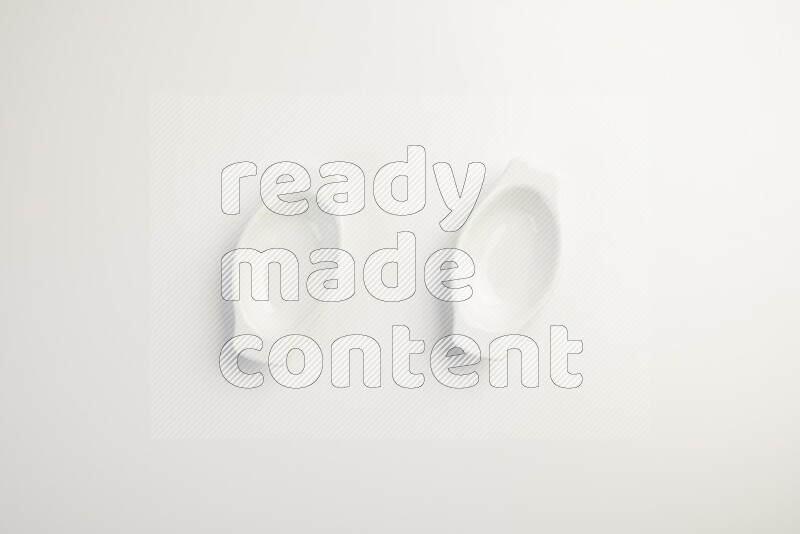 white ceramic oval sauce dish on white countertop