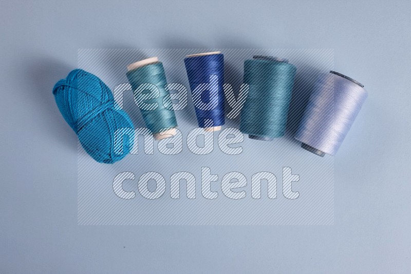 Blue sewing supplies on blue background