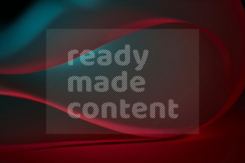 An abstract art piece displaying smooth curves in blue and red gradients created by colored light