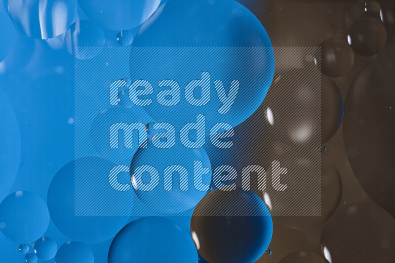 لقطات مقربة لفقاعات من الزيت على سطح الماء باللون الأزرق والبني