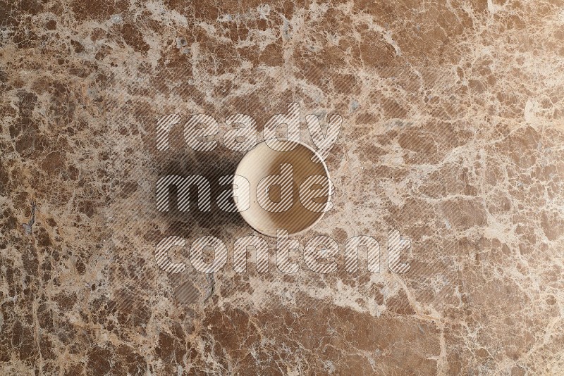 Top View Shot Of A White Pottery bowl On beige Marble Flooring