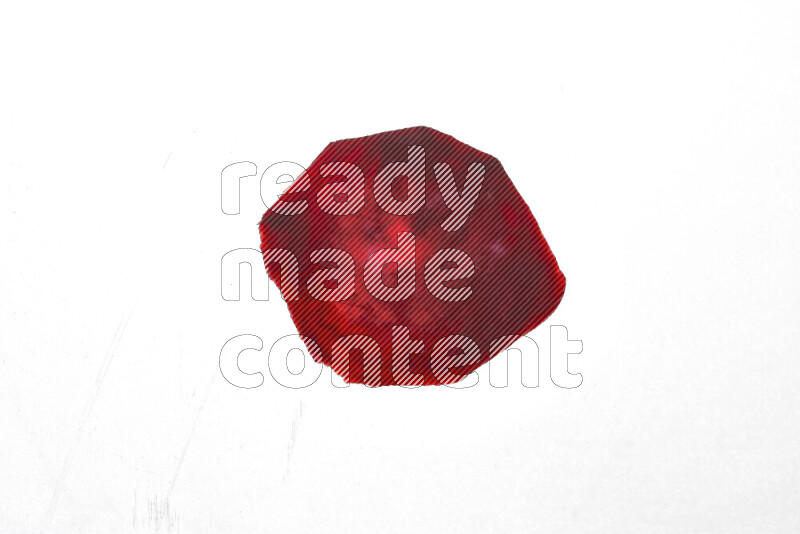 Beet slices on illuminated white background
