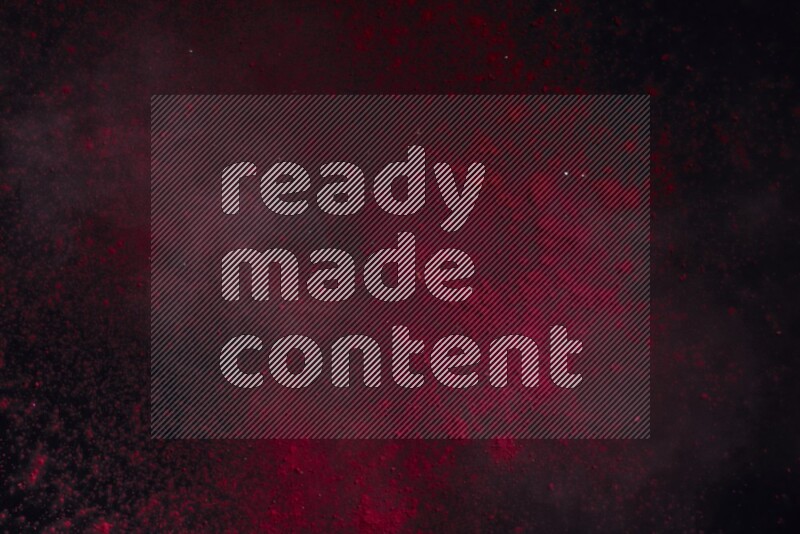 Red powder explosion on black background