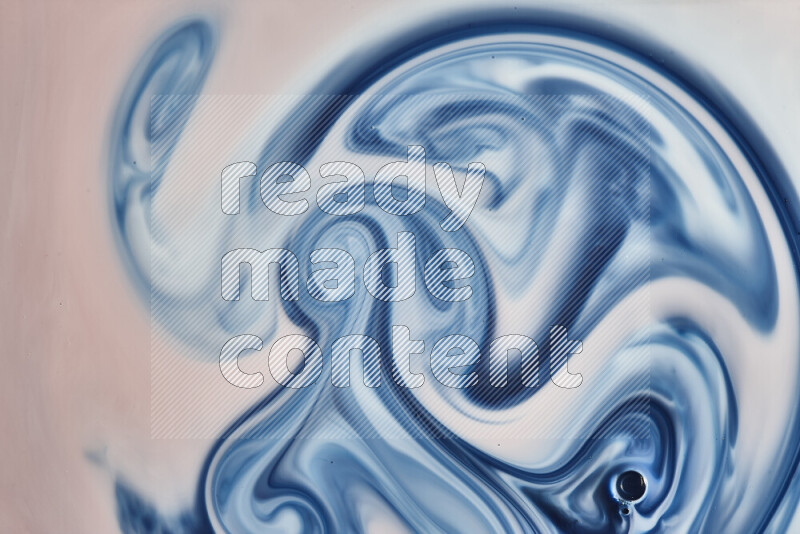 A close-up of abstract swirling patterns in blue, red and white