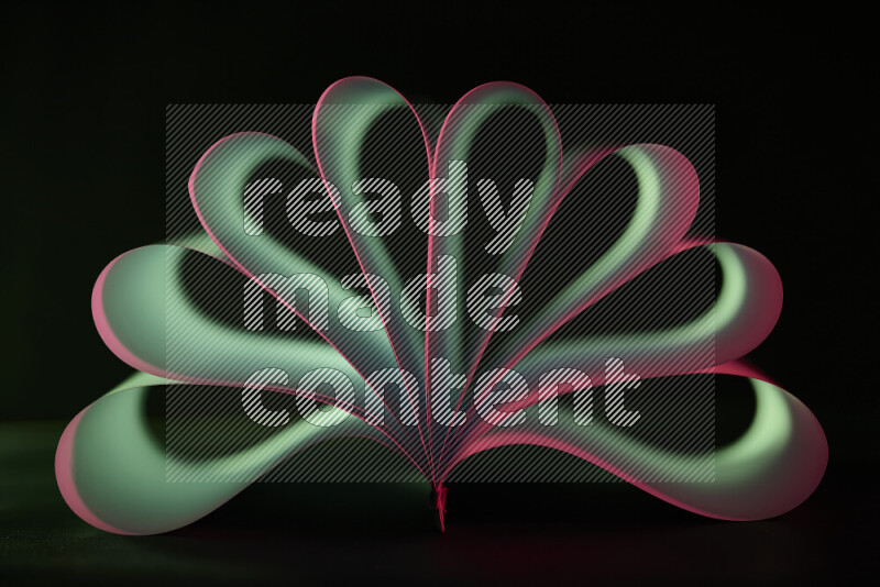 An abstract art piece displaying smooth curves in pink and green gradients created by colored light