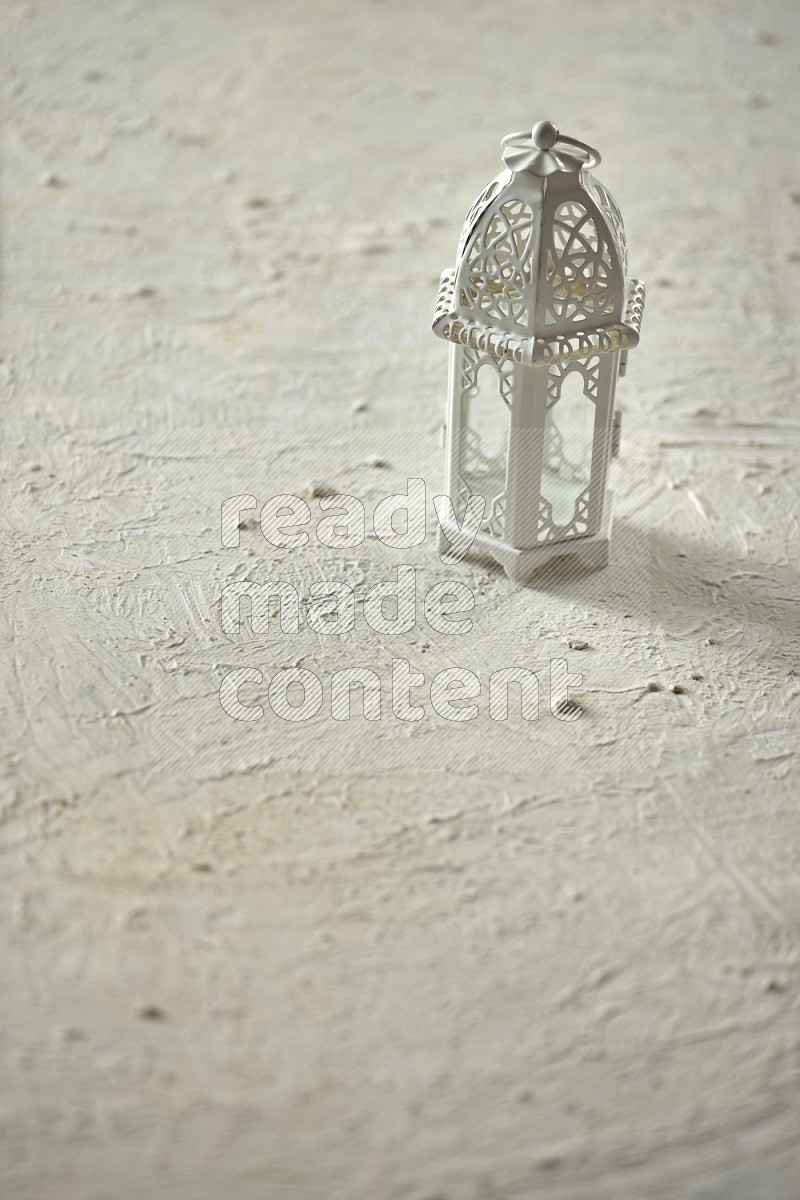 A lantern on textured white background