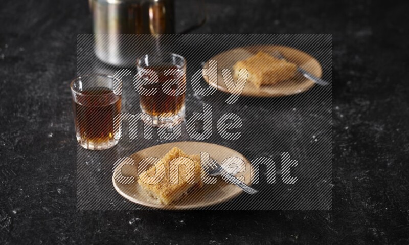 konafa with tea in a dark setup