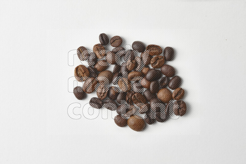 Roasted coffee beans on white background