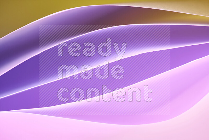 This image showcases an abstract paper art composition with paper curves in purple and gold gradients created by colored light
