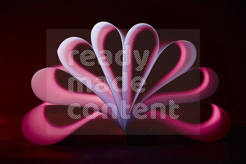 An abstract art piece displaying smooth curves in pink and purple gradients created by colored light