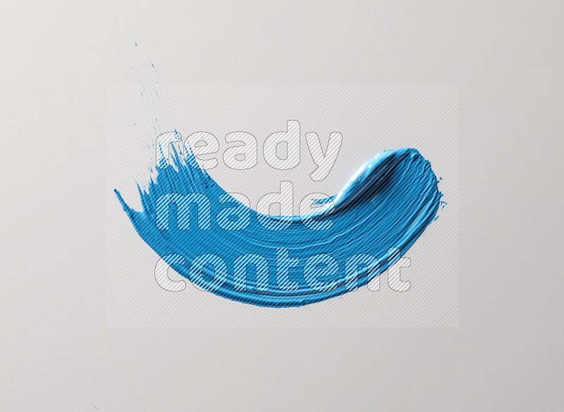 A single blue curved brush stroke on a white background
