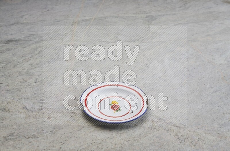 A vintage metal plate on grey marble background