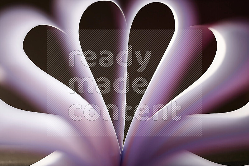 An abstract art piece displaying smooth curves in white and purple gradients created by colored light