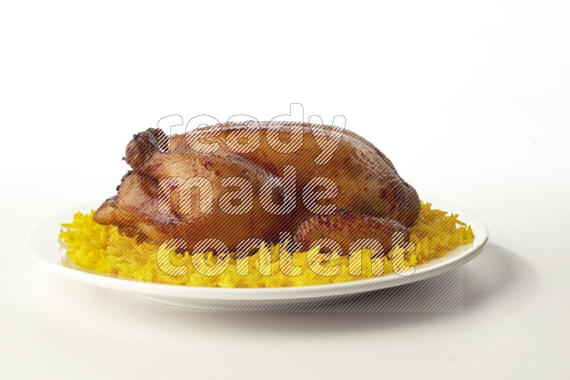 yellow  basmati Rice with  whole roasted chicken on a white rounded plate direct on white background