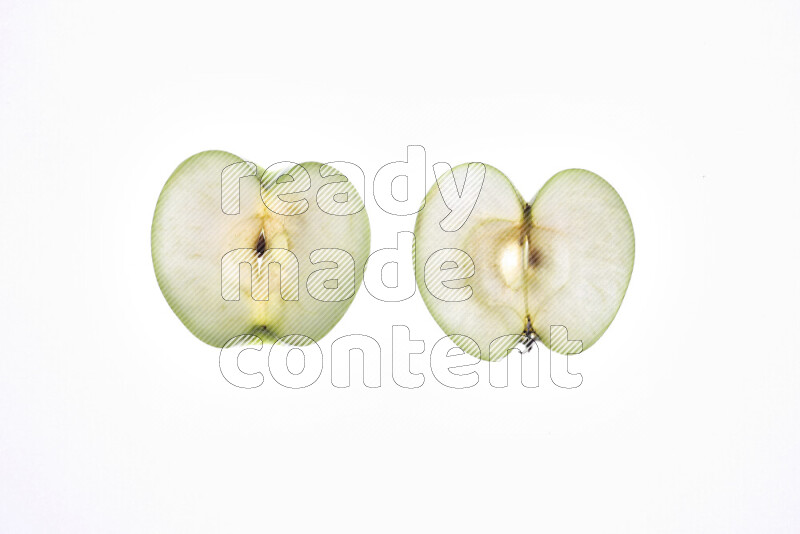 Apple slices on illuminated white background