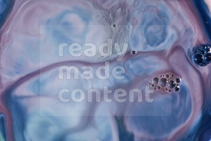 A close-up of abstract swirling patterns in blue, red and white