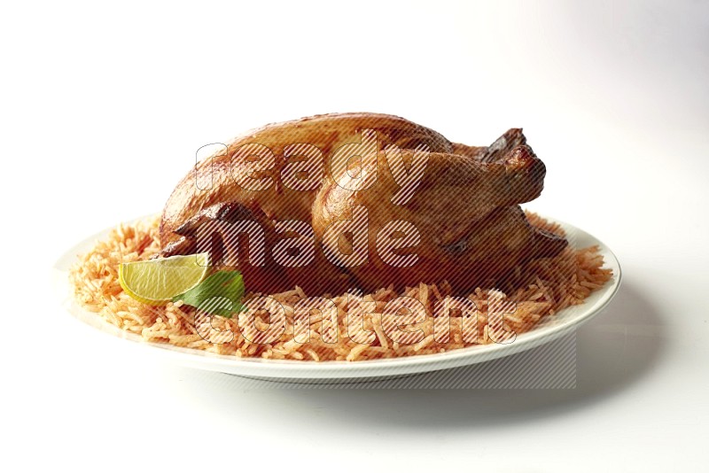 red basmati Rice with  whole roasted chicken on a white rounded plate  direct  on white background