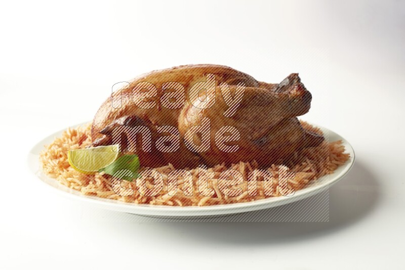 red basmati Rice with  whole roasted chicken on a white rounded plate  direct  on white background