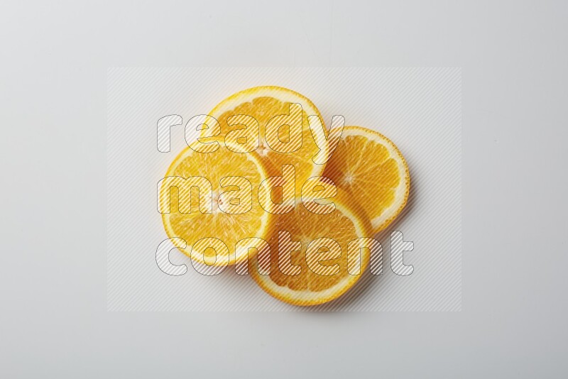 Four orange slices on a white background