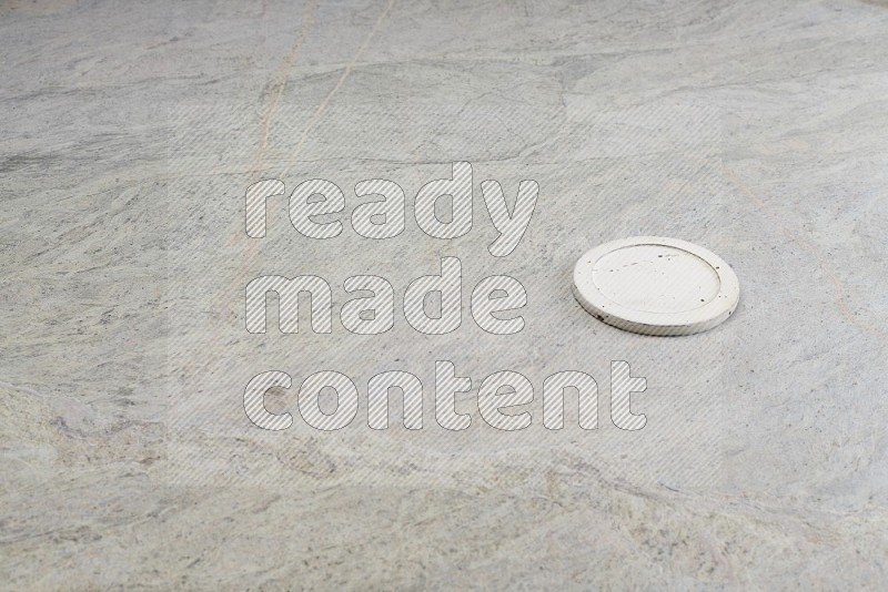 White Pottery Bowl's Lid On Grey Marble Flooring
