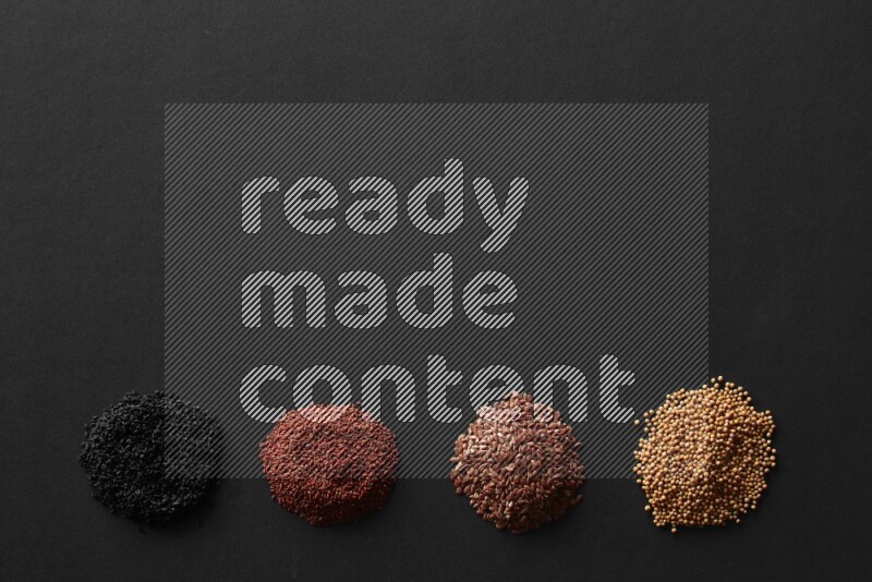 حبة البركة و حبوب الخردل وحبوب الكتان وحب الرشاد علي خلفية سوداء