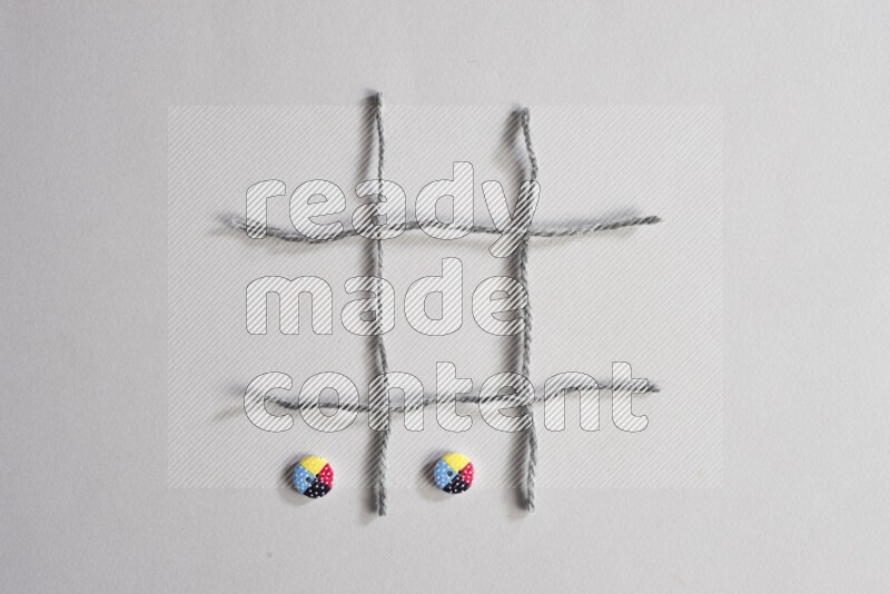 Multicolored buttons placed on grey background