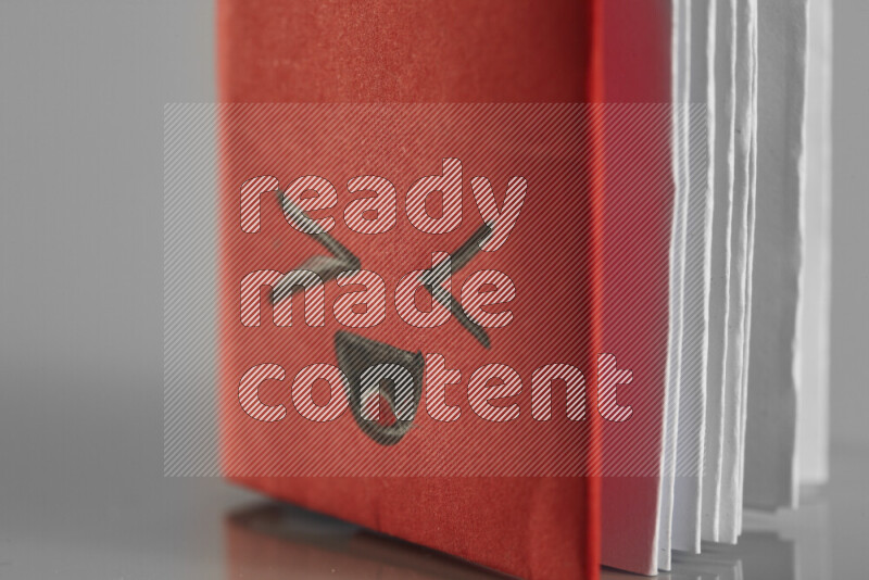 Origami book on grey background
