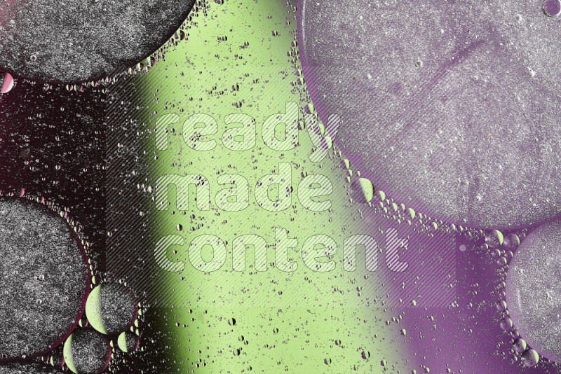 لقطات مقربة لفقاعات من الزيت على سطح الماء باللون الأخضر والأرجواني والوردي