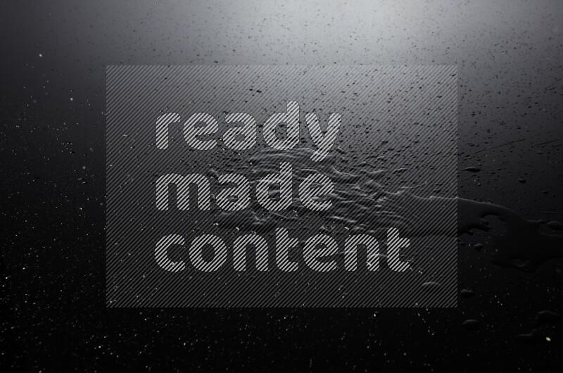 water drops, and droplets on black background