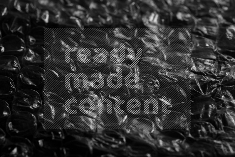 Bubble wrap texture on black background