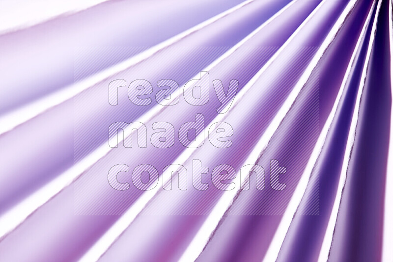 An image presenting an abstract paper pattern of lines in white and purple tones