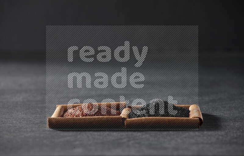 2 squares of cinnamon sticks full of garden cress and black seeds on black flooring