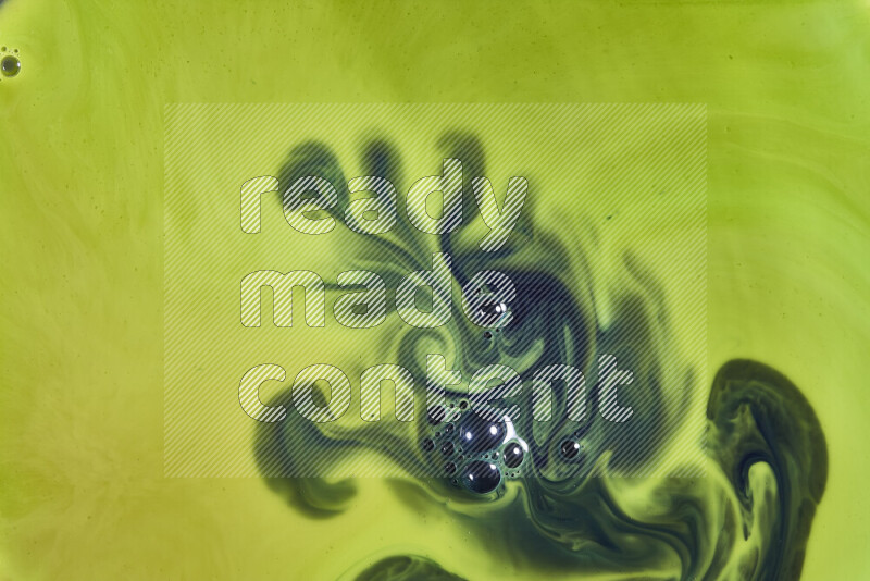 A close-up of abstract swirling patterns in green gradients