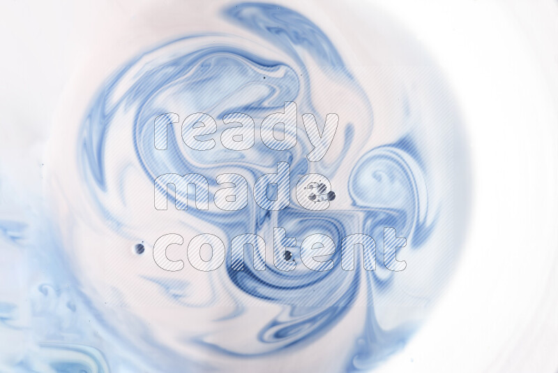 A close-up of abstract swirling patterns in blue and white