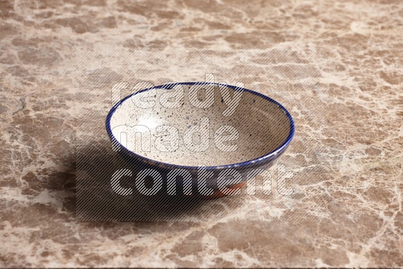 Multicolored Pottery Bowl on Beige Marble Flooring