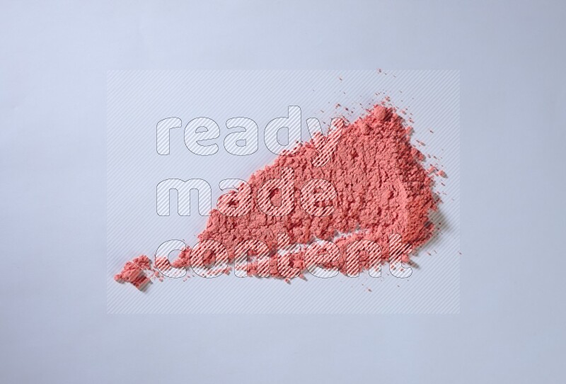Red powder strokes on white background