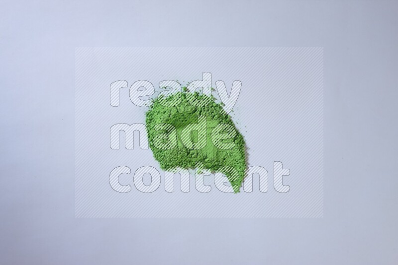 Green powder strokes on white background