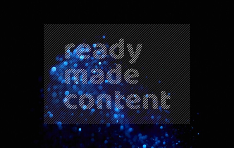 Blue glitter powder isolated on black background