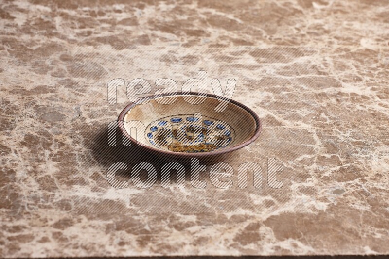 Decorative Pottery Plate on Beige Marble Flooring