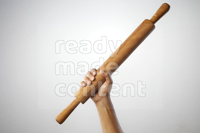 Male Hand Holding Rolling Pin on white background